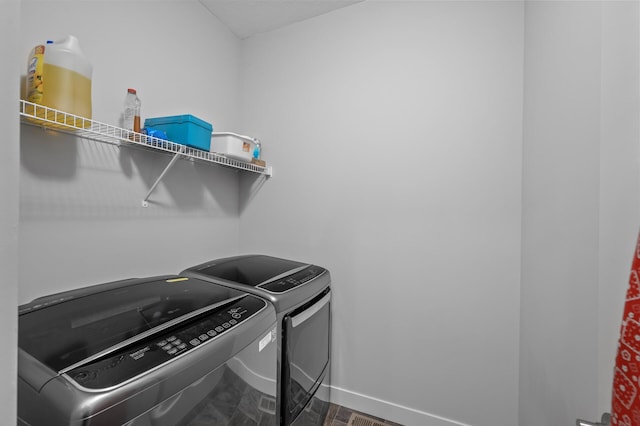 11062 16th St NE, Saint Michael, MN 55376 - laundry room featuring washing machine and clothes dryer and baseboards