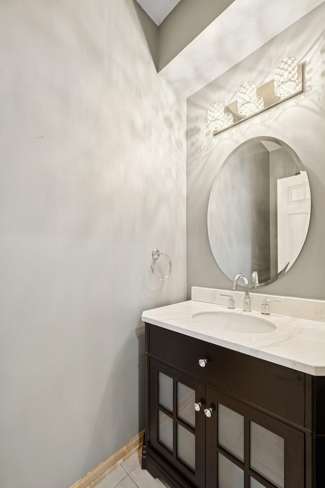 12245 Urbank St NE Unit E, Blaine, MN 55449 - bathroom with vanity and tile patterned floors
