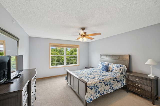 12245 Urbank St NE Unit E, Blaine, MN 55449 - bedroom with light colored carpet, ceiling fan, a textured ceiling, and baseboards