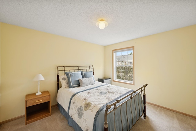 12245 Urbank St NE Unit E, Blaine, MN 55449 - bedroom featuring carpet floors, baseboards, and a textured ceiling