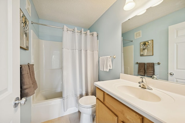 12245 Urbank St NE Unit E, Blaine, MN 55449 - bathroom featuring vanity, toilet, shower / tub combo, tile patterned flooring, and a textured ceiling
