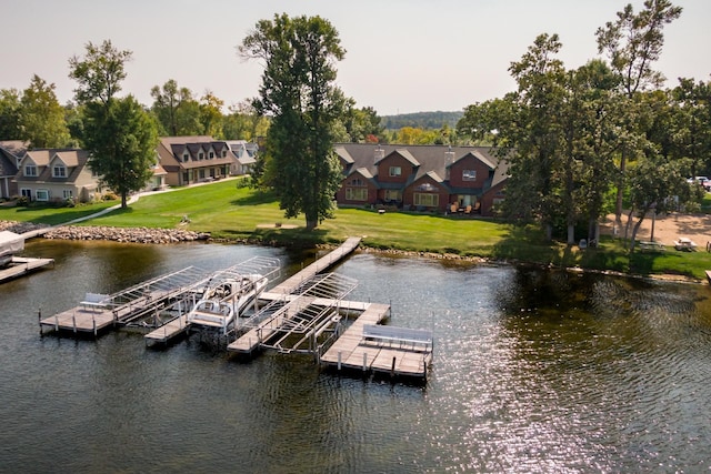 dock with a water view and a lawn