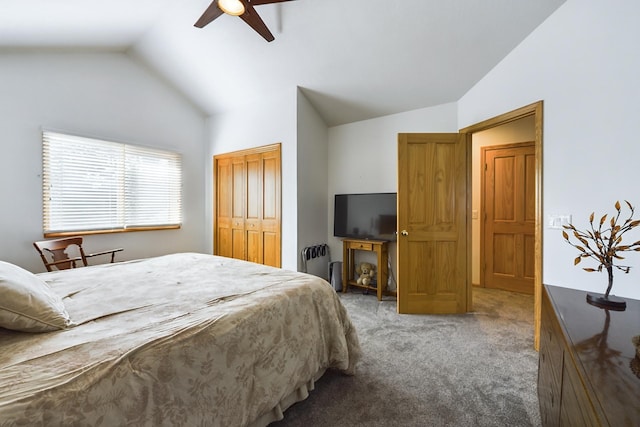 carpeted bedroom featuring vaulted ceiling, a closet, and ceiling fan