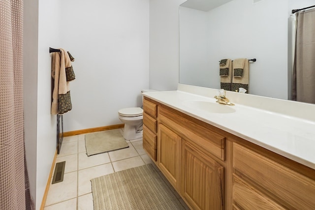 bathroom featuring tile patterned flooring, toilet, vanity, baseboards, and a shower with shower curtain