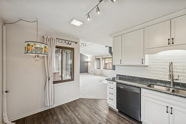 kitchen featuring a sink, dark stone counters, dark wood-type flooring, stainless steel dishwasher, and baseboards