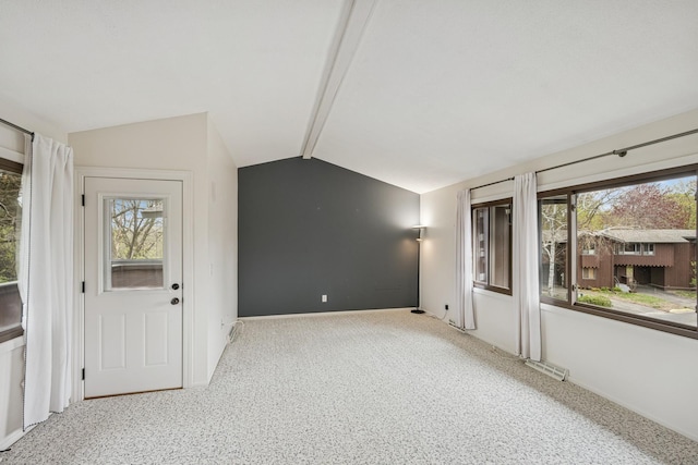 foyer entrance featuring carpet flooring, lofted ceiling with beams, visible vents, and baseboards