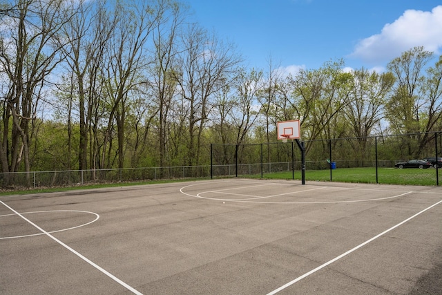 view of basketball court with fence and community basketball court