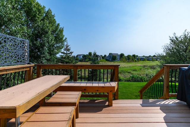 wooden terrace with a yard