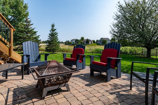 view of patio featuring an outdoor fire pit