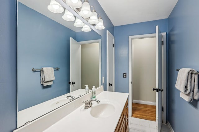 2016 90th St, Bloomington, MN 55431 - bathroom featuring vanity, tile patterned floors, and baseboards