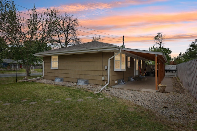 2016 90th St, Bloomington, MN 55431 - property exterior at dusk featuring a patio and a shingled roof