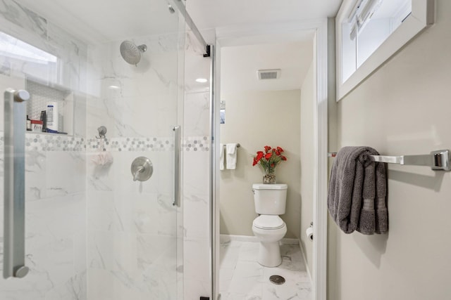 2016 90th St, Bloomington, MN 55431 - bathroom with toilet, a marble finish shower, marble look tile flooring, and baseboards