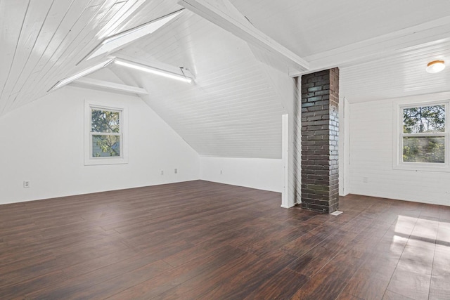additional living space with vaulted ceiling and wood-type flooring