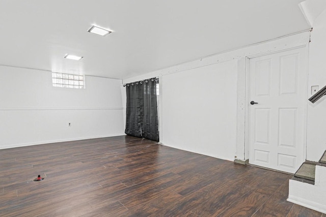 unfurnished room with wood finished floors