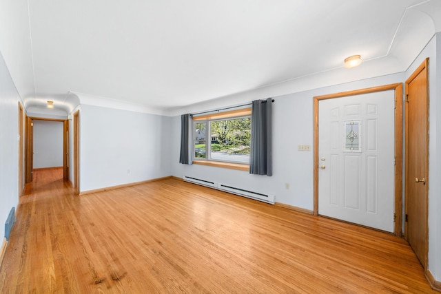 600 Mclean St, Mora, MN 55051 - entryway featuring a baseboard heating unit, light wood finished floors, baseboards, and crown molding