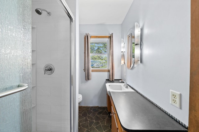 600 Mclean St, Mora, MN 55051 - bathroom with a stall shower, vanity, and toilet