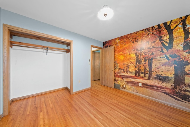 600 Mclean St, Mora, MN 55051 - unfurnished bedroom with wood finished floors and baseboards