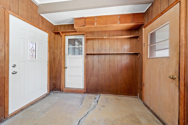 600 Mclean St, Mora, MN 55051 - entrance foyer featuring unfinished concrete floors and wood walls