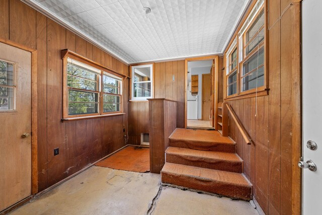 600 Mclean St, Mora, MN 55051 - doorway to outside with wooden walls and stairway