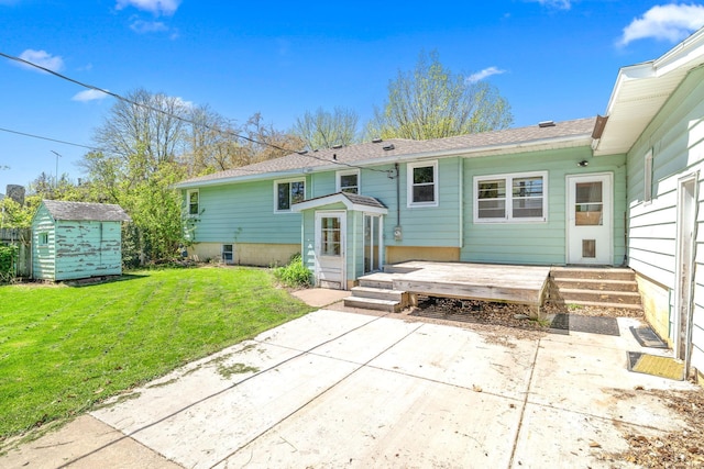600 Mclean St, Mora, MN 55051 - rear view of property with a patio, a yard, a storage unit, and an outdoor structure