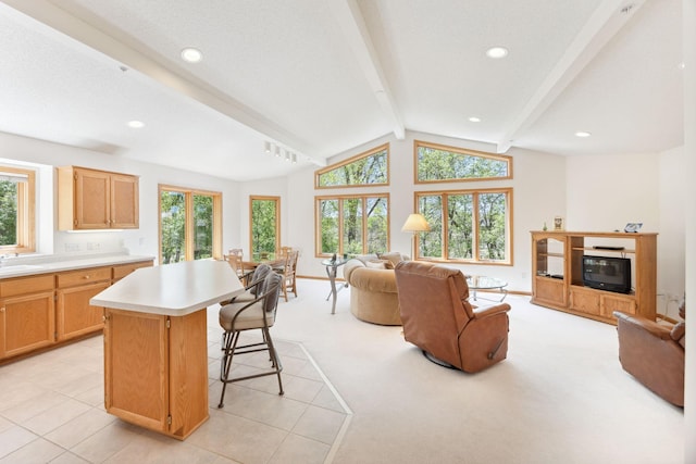 10715 57th Ave N, Plymouth, MN 55442 - kitchen with open floor plan, light countertops, a kitchen island, a sink, and recessed lighting