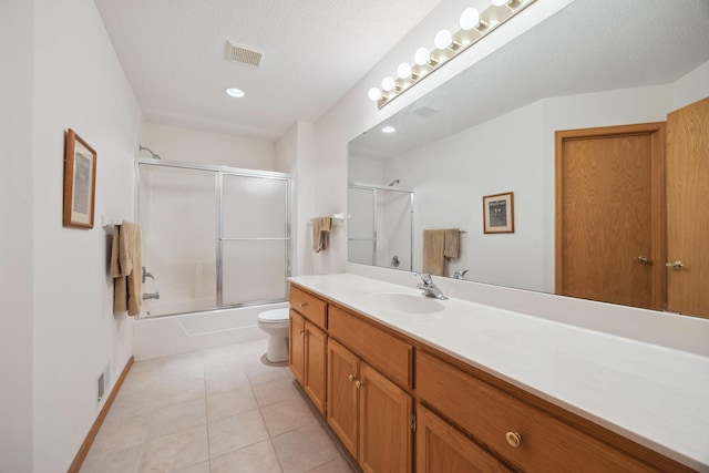 10715 57th Ave N, Plymouth, MN 55442 - bathroom featuring vanity, tile patterned floors, toilet, shower / bath combination with glass door, and recessed lighting