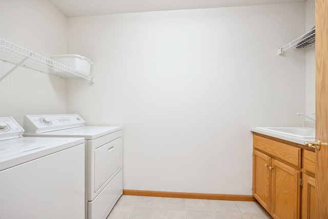 10715 57th Ave N, Plymouth, MN 55442 - laundry room featuring washer and clothes dryer, baseboards, and cabinet space