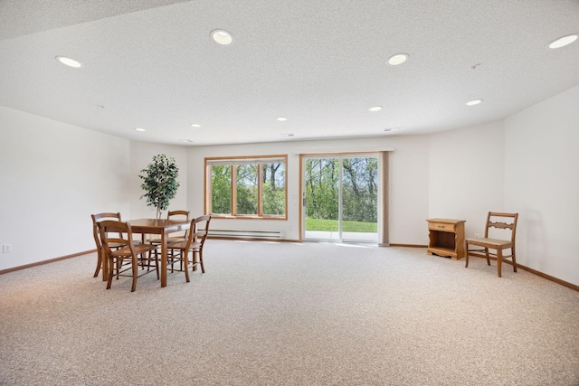 10715 57th Ave N, Plymouth, MN 55442 - carpeted dining area featuring recessed lighting, baseboards, a baseboard radiator, and a textured ceiling