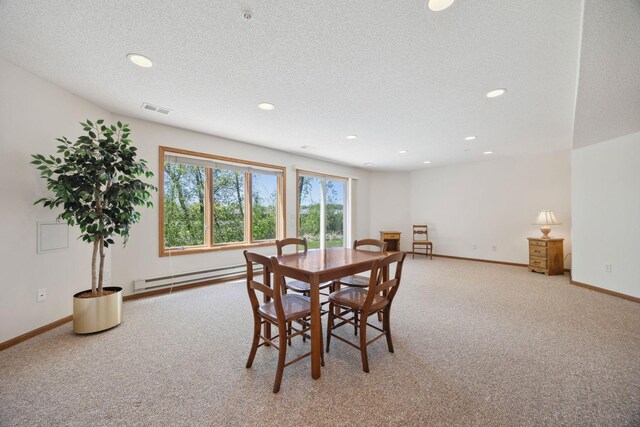 10715 57th Ave N, Plymouth, MN 55442 - dining room with a baseboard heating unit, light colored carpet, recessed lighting, a textured ceiling, and baseboards
