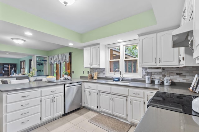 1228 Tamberwood Trl, Woodbury, MN 55125 - kitchen featuring dishwasher, a peninsula, a sink, decorative backsplash, and white cabinetry
