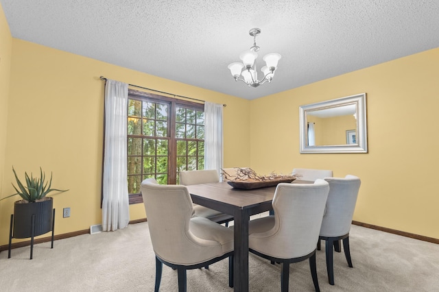 1228 Tamberwood Trl, Woodbury, MN 55125 - dining space featuring a chandelier, light carpet, a textured ceiling, and baseboards