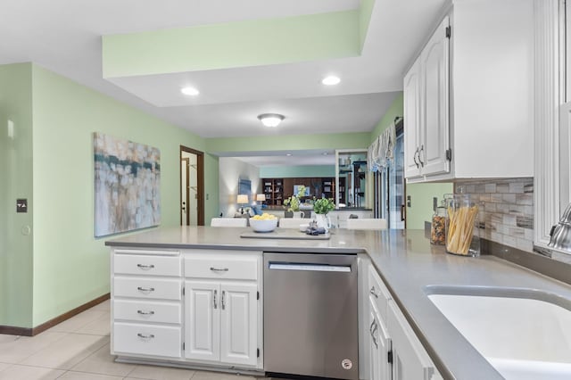 1228 Tamberwood Trl, Woodbury, MN 55125 - kitchen featuring stainless steel dishwasher, a sink, a peninsula, white cabinets, and recessed lighting