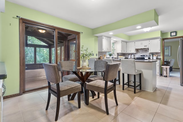 1228 Tamberwood Trl, Woodbury, MN 55125 - dining space featuring light tile patterned floors, recessed lighting, and baseboards