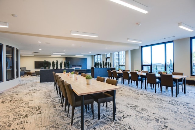 dining space with a wall of windows