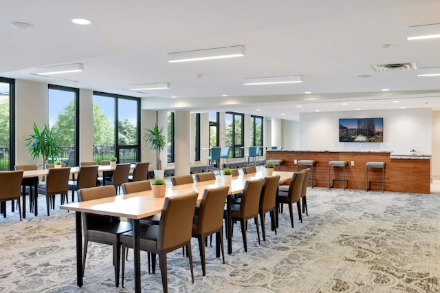 dining space featuring healthy amount of natural light and recessed lighting