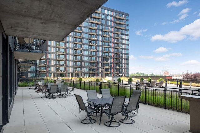 view of patio / terrace with outdoor dining area and fence