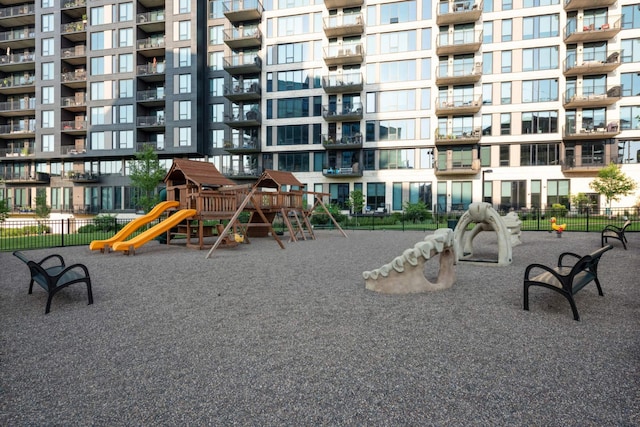 view of property's community featuring fence