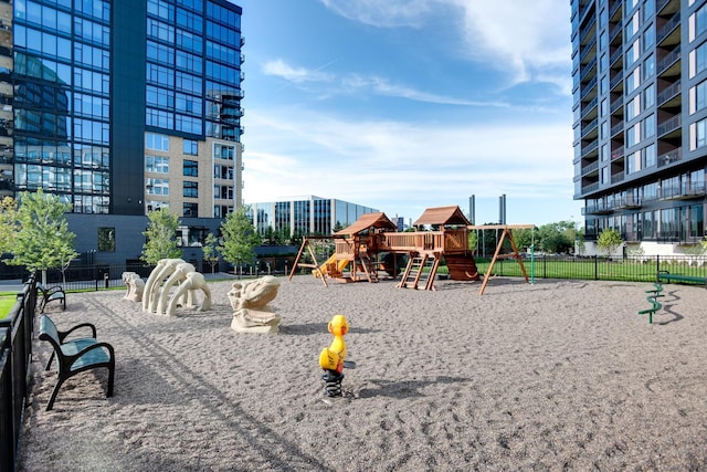 view of property's community featuring fence