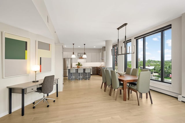 1240 2nd St Unit 301, Minneapolis, MN 55415 - dining area featuring light wood-style floors and a desk