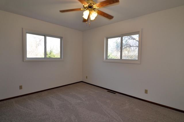 811 Pleasant Ave S, Park Rapids, MN 56470 - carpeted spare room featuring ceiling fan, baseboards, a healthy amount of sunlight, and visible vents