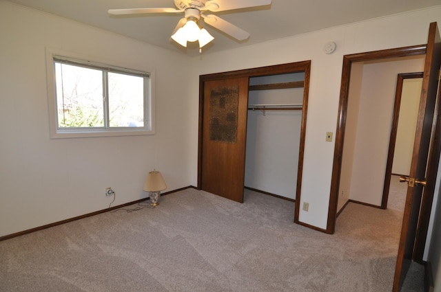 811 Pleasant Ave S, Park Rapids, MN 56470 - unfurnished bedroom with carpet, a closet, baseboards, and a ceiling fan