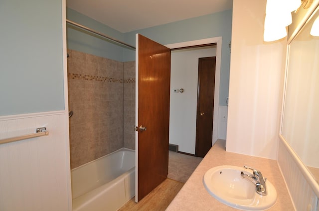 811 Pleasant Ave S, Park Rapids, MN 56470 - full bathroom featuring wainscoting, bathing tub / shower combination, and vanity