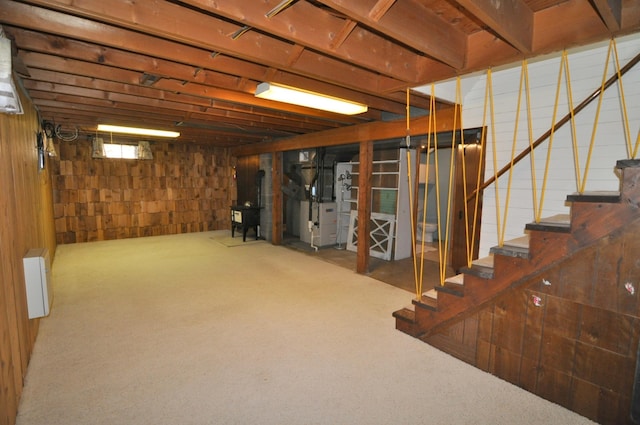 811 Pleasant Ave S, Park Rapids, MN 56470 - basement featuring stairway, heating unit, carpet flooring, and radiator heating unit