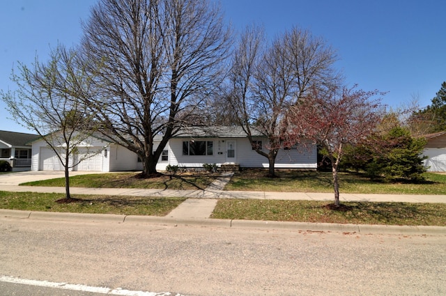 811 Pleasant Ave S, Park Rapids, MN 56470 - view of front of house with concrete driveway and an attached garage