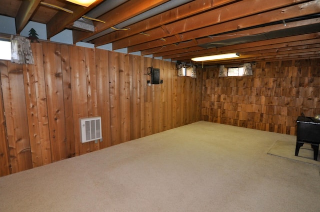 811 Pleasant Ave S, Park Rapids, MN 56470 - basement featuring carpet flooring, visible vents, and wood walls