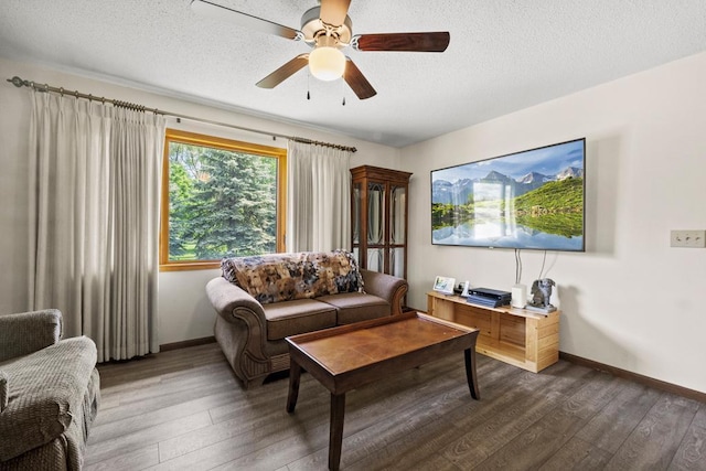 12201 Olive St NW, Coon Rapids, MN 55448 - living room featuring wood finished floors, baseboards, ceiling fan, and a textured ceiling