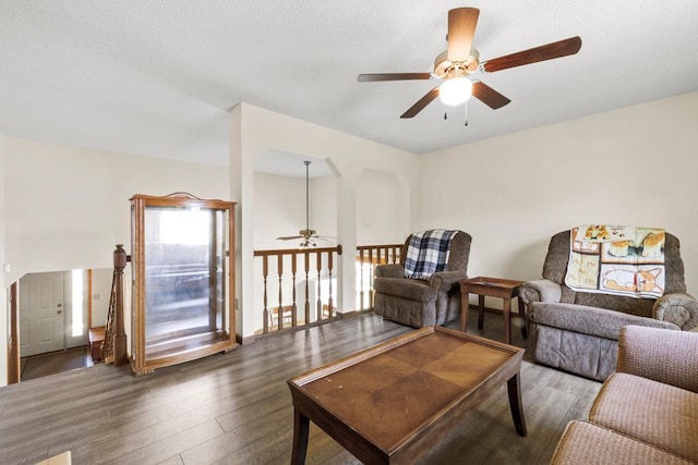 12201 Olive St NW, Coon Rapids, MN 55448 - living area featuring ceiling fan and wood finished floors