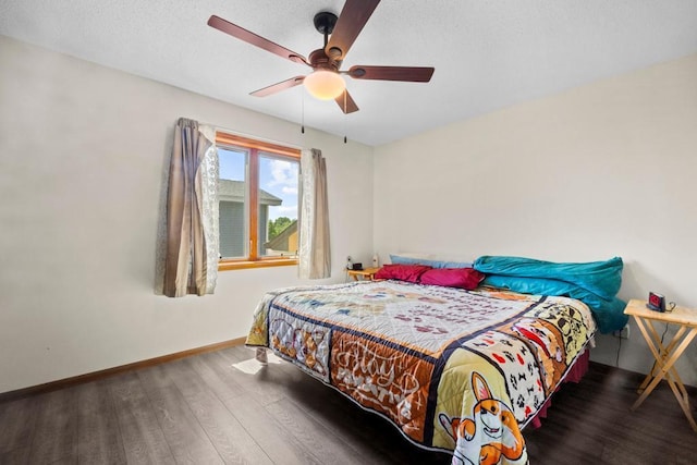 12201 Olive St NW, Coon Rapids, MN 55448 - bedroom featuring wood finished floors, baseboards, and ceiling fan