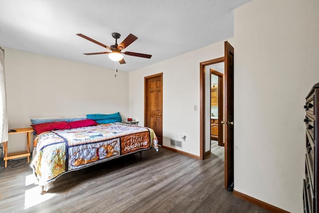 12201 Olive St NW, Coon Rapids, MN 55448 - bedroom featuring wood finished floors, baseboards, a ceiling fan, and a textured ceiling