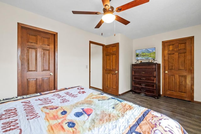 12201 Olive St NW, Coon Rapids, MN 55448 - bedroom with dark wood finished floors, baseboards, and ceiling fan